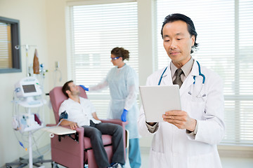 Image showing Doctor Using Digital Tablet In Chemo Room