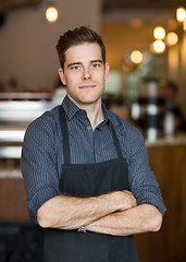 Image showing Young Owner Standing Arms Crossed In Cafe