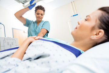 Image showing Nurse Preparing Patient For Xray