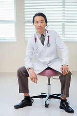 Image showing Cancer Specialist Sitting On Chair In Hospital Room