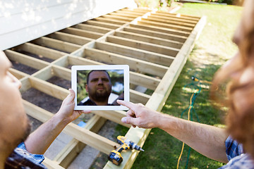 Image showing Carpenters Using Digital Tablet At Construction Site