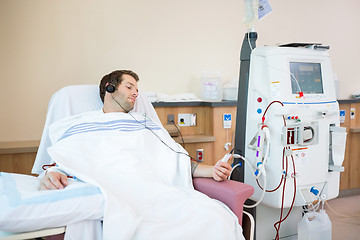 Image showing Patient Listening To Music While Receiving Renal Dialysis