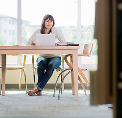 Image showing Portrait Of Student Sitting In Library