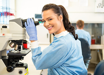 Image showing Researcher Using Microscope In Laboratory