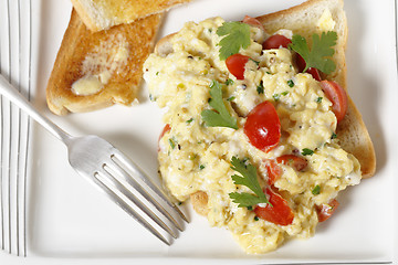 Image showing Scrambled egg and tomatoes from above