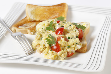 Image showing Scrambled egg and tomatoes on toast
