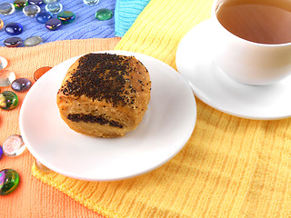 Image showing polish poppy seed cake on white plate and cup of tea (coffee) and stone set