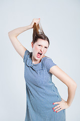 Image showing Attractive woman pulling her hair