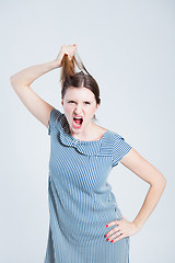 Image showing Attractive woman pulling her hair