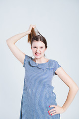 Image showing Attractive woman pulling her hair