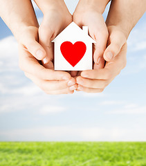 Image showing couple hands holding white paper house