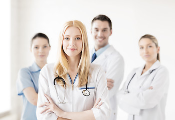 Image showing female doctor in front of medical group