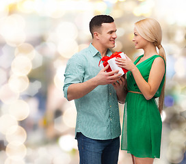 Image showing smiling couple with gift box