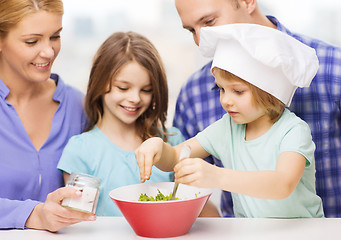 Image showing happy family with two kids eating at home