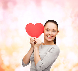 Image showing smiling asian woman with red heart