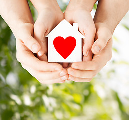 Image showing couple hands holding white paper house