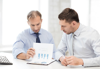 Image showing businessmen with notebook on meeting