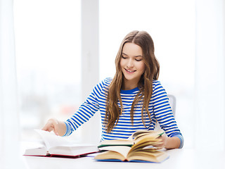 Image showing happy smiling student girl with books