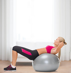 Image showing smiling woman with fitness ball