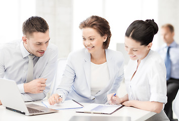 Image showing business team discussing something in office