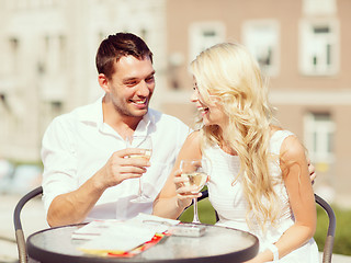 Image showing couple drinking wine in cafe