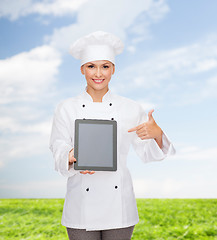 Image showing smiling female chef with tablet pc blank screen