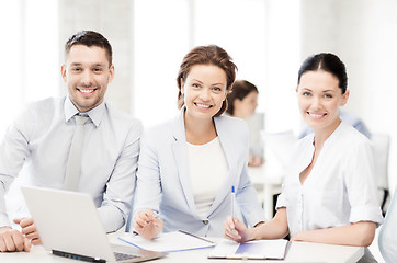 Image showing business team discussing something in office