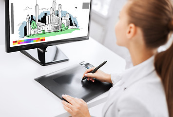 Image showing architect with drawing tablet in office