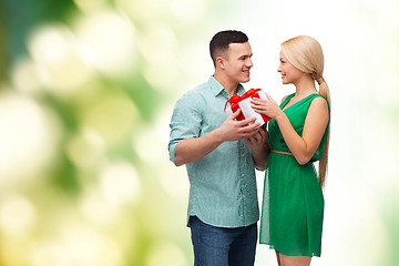 Image showing smiling couple with gift box