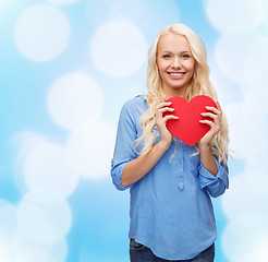 Image showing smiling woman with red heart