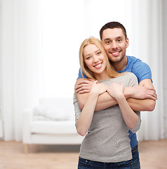 Image showing smiling couple hugging