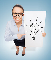 Image showing smiling businesswoman with white board