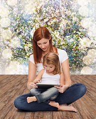 Image showing happy mother with little girl and tablet pc