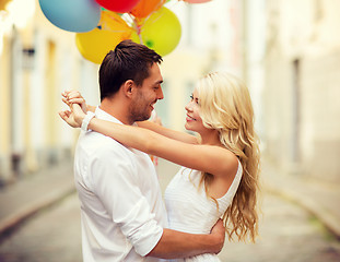 Image showing couple with colorful balloons