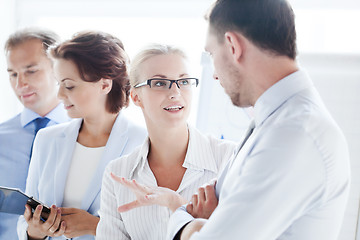 Image showing man and woman having discussion in office