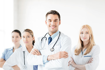 Image showing male doctor in front of medical group