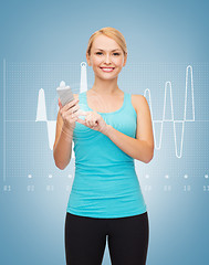 Image showing sporty woman with smartphone