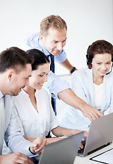 Image showing group of people working in call center