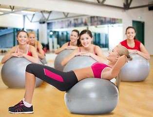 Image showing smiling woman with fitness ball