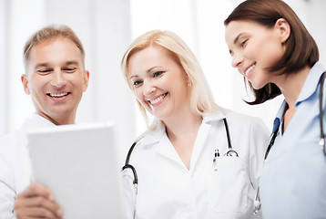 Image showing doctors looking at tablet pc