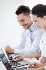 Image showing man and woman working with laptop in office