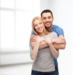 Image showing smiling couple hugging