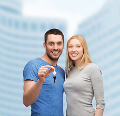 Image showing smiling couple holding keys