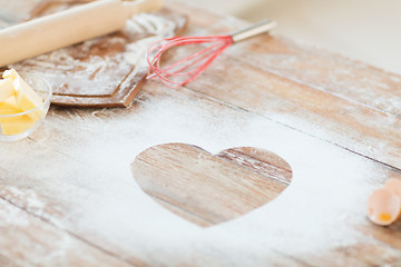 Image showing close up of heart of flour on wooden table at home