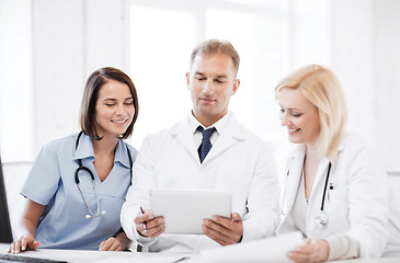 Image showing doctors looking at tablet pc