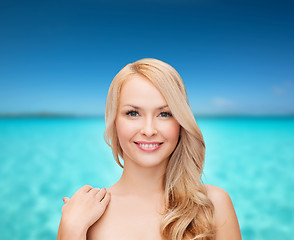 Image showing face and shoulders of happy woman with long hair