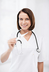 Image showing doctor with thermometer and stethoscope