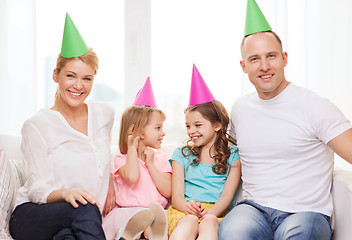 Image showing happy family with two kids in hats celebrating