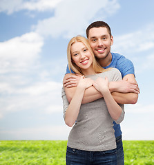 Image showing smiling couple hugging