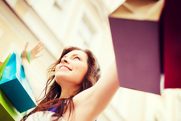 Image showing woman with shopping bags in city